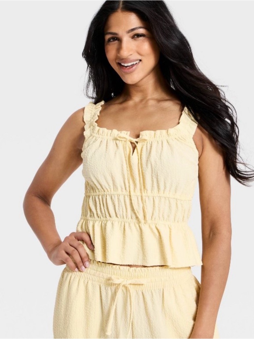 Sleeveless Ruffle-Trim Yellow Peplum Top